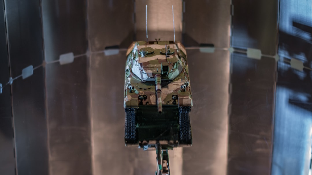 A military tank is hanging on the ceiling.