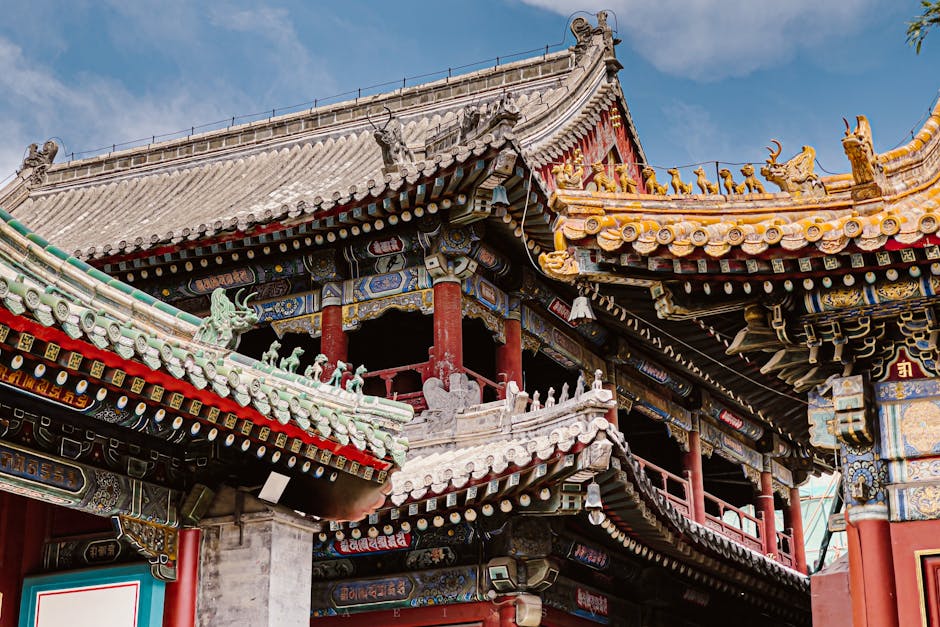 Intricate eaves and vibrant colors of a traditional temple in Beijing.