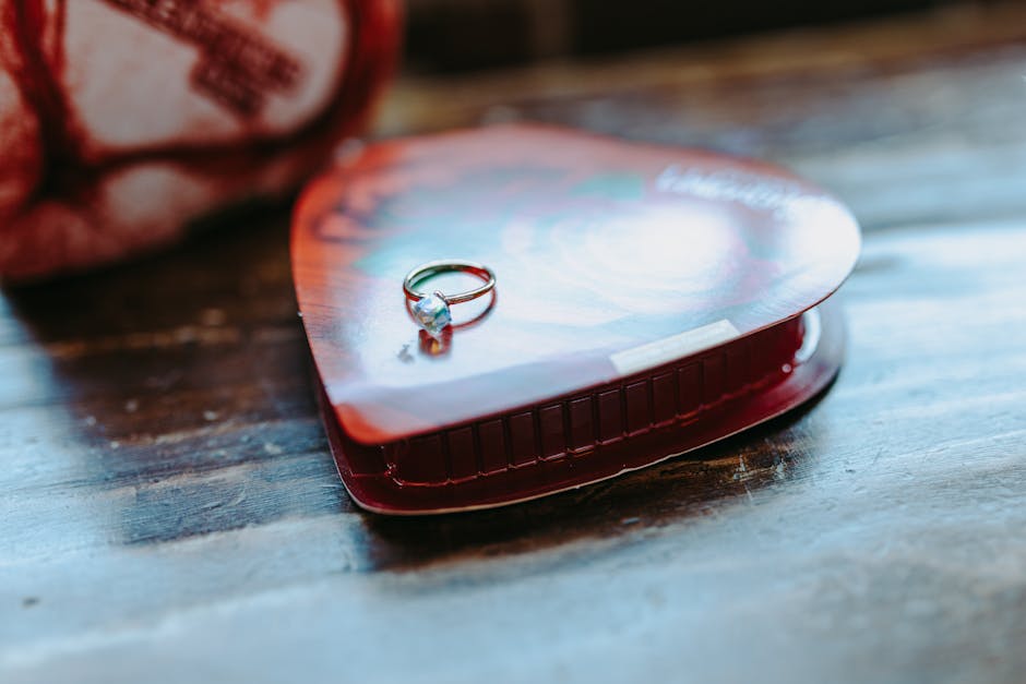 A diamond ring placed on a heart-shaped chocolate box, perfect for Valentine gifts.